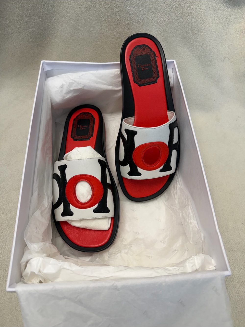 Christian Dior 
White, Red & Black Logo Slide Sandals